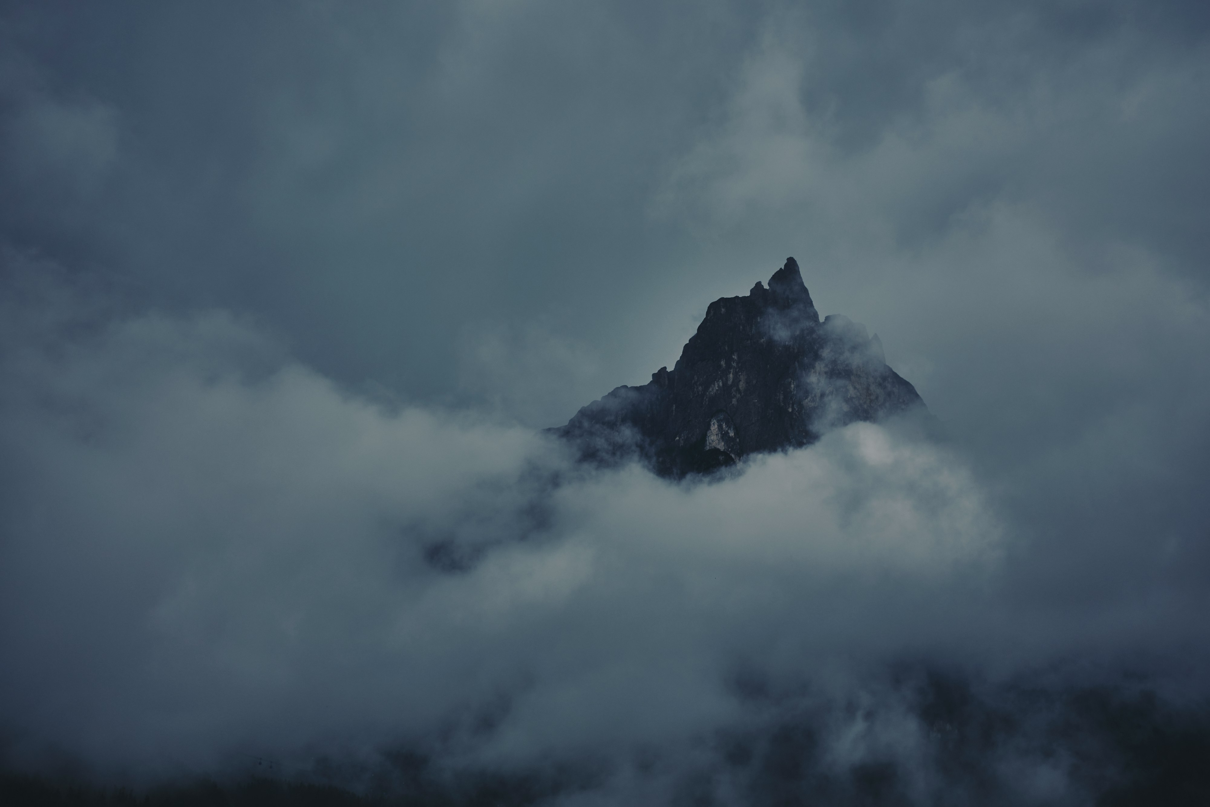 black mountain under white clouds